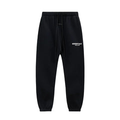 Fog Essentials White‑Print Solid‑Black Baggy Elastic‑Cuff Jogger Sweatpants