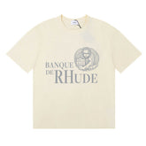 Rhude Banque De Rhude Lion Emblem Graphic Cream Short Sleeve T‑Shirt